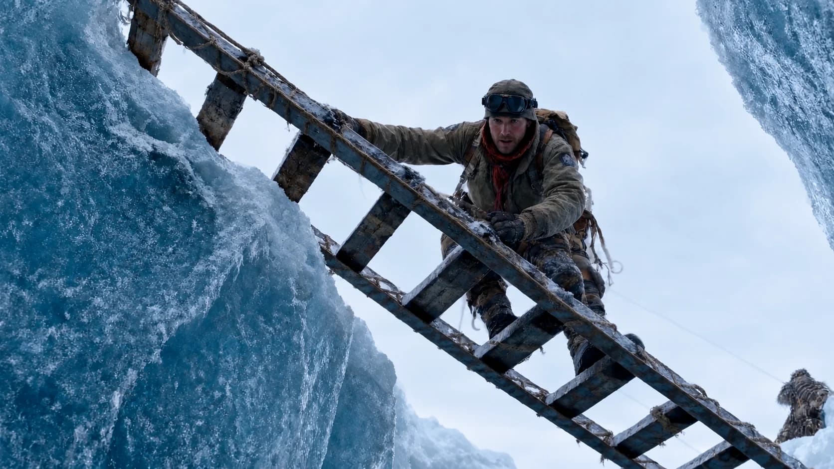 A climber crossing an icy crevasse on a ladder